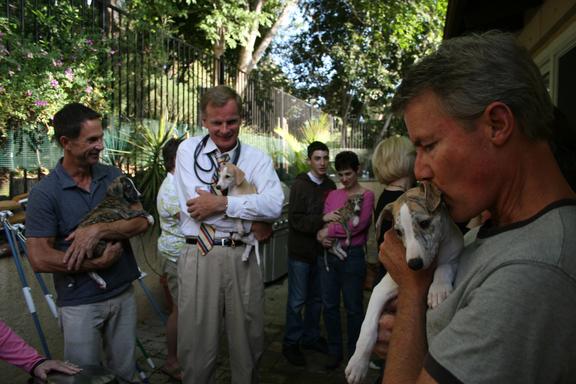 Happy Dads and Griffin Co-Owners Reed Hellyer (with Puppy 4), Bo Bengtson (with Pup 2), and Michael Strockbine (with Pup 6). In back, the Goodweins of Koppertone (breeders of our Vizsla special Shani) meet pup 9, male.
